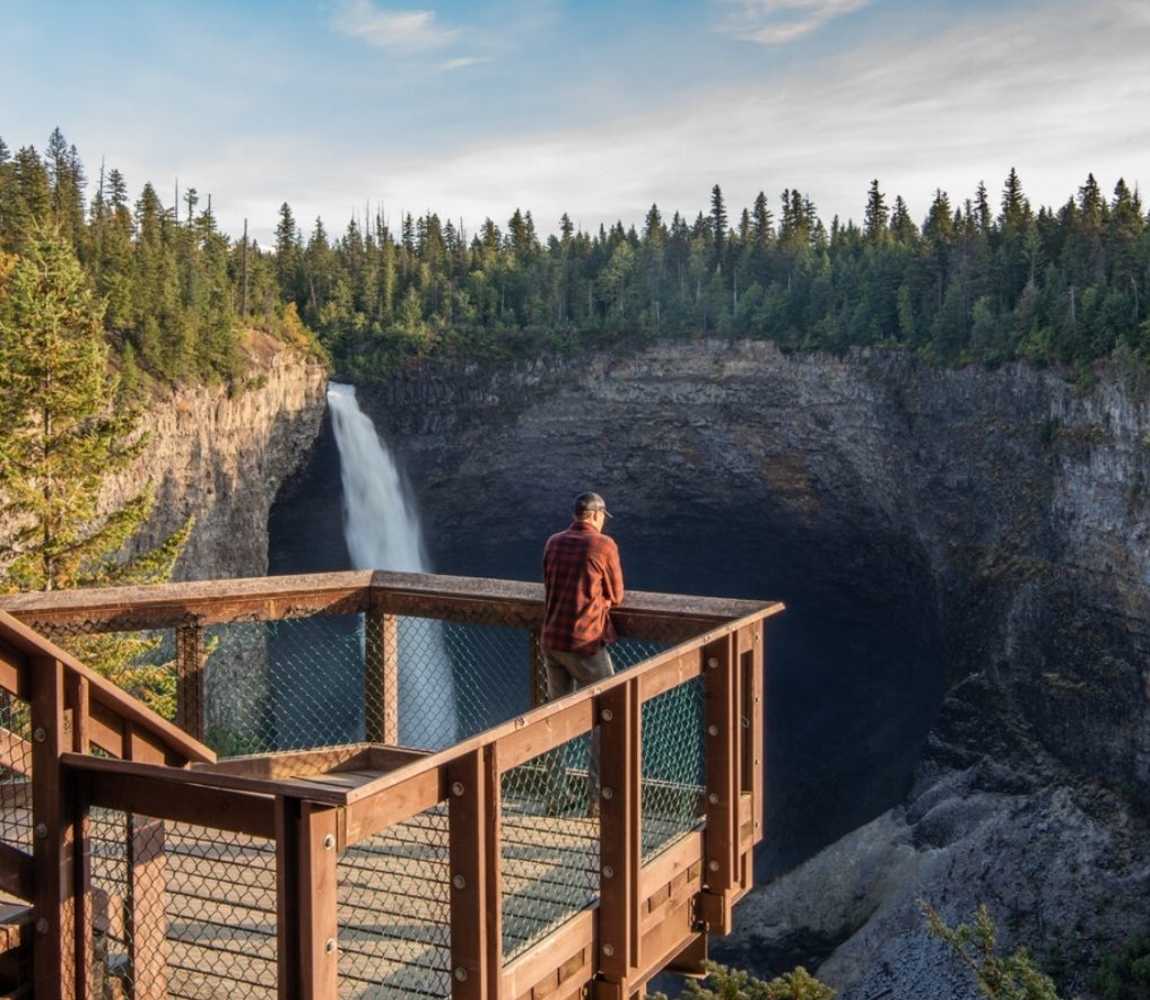 Man on viewing platform overlooking Helmcken Falls in Wells Gray Provincial Park