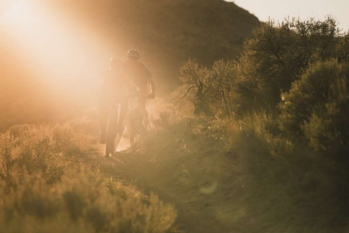 Couple biking in Lac du Bois during golden hour