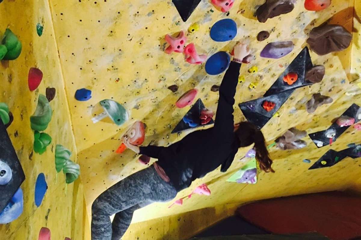 Woman climbing at Cliffside Climbing Gym in Kamloops, BC.