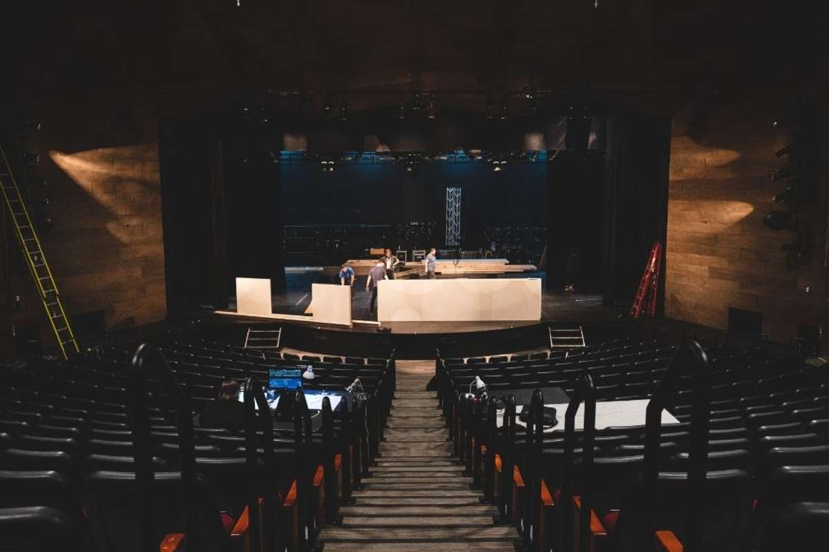 bird's eye view of a theatre with props and display getting set up