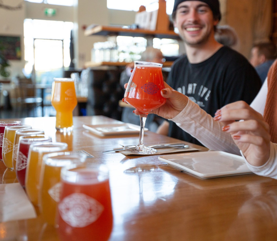 Couple Drinking their beers at Bright Eye Brewing in Kamloops, BC.