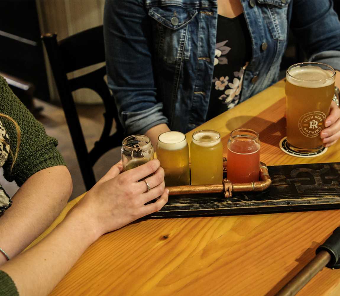 Enjoying a flight and a pint at Iron Road Brewing