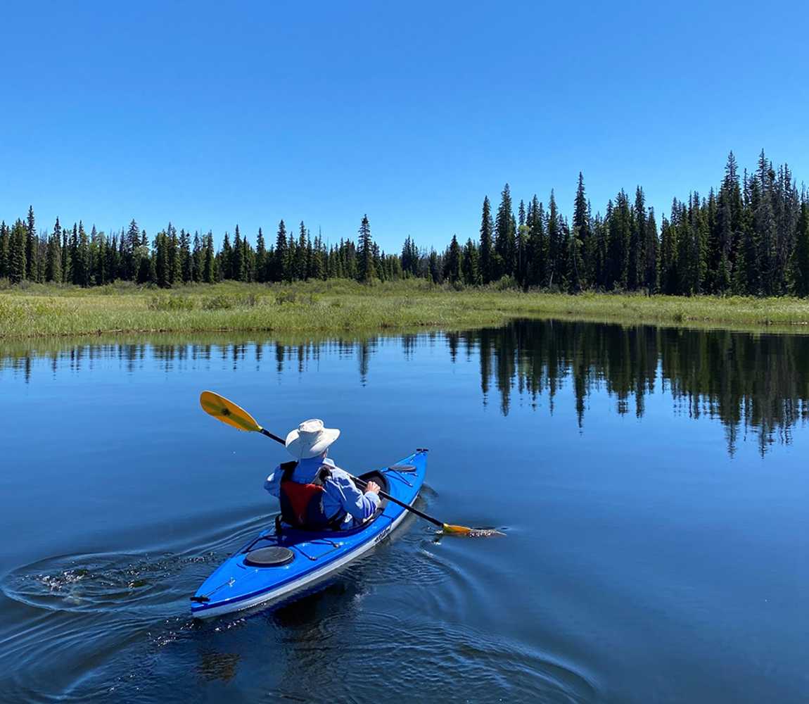 one individual kayaking on a lake