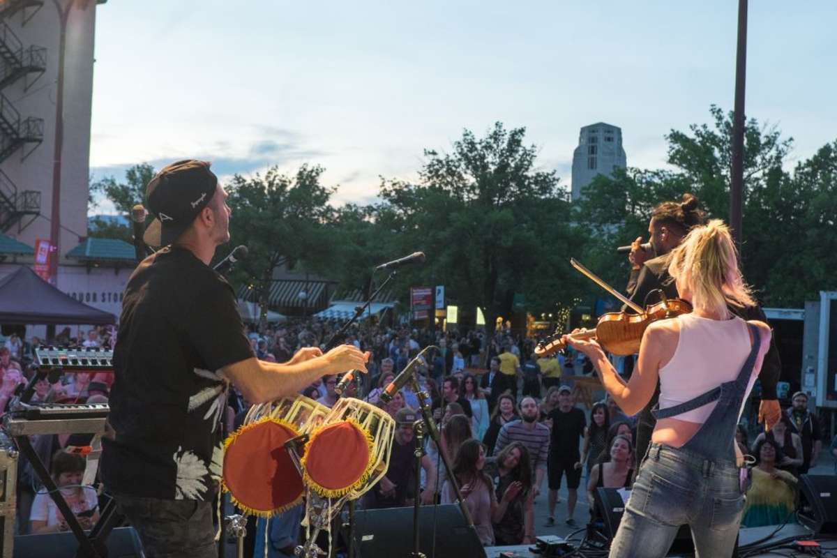 drum player and violinist on stage in downtown Kamloops