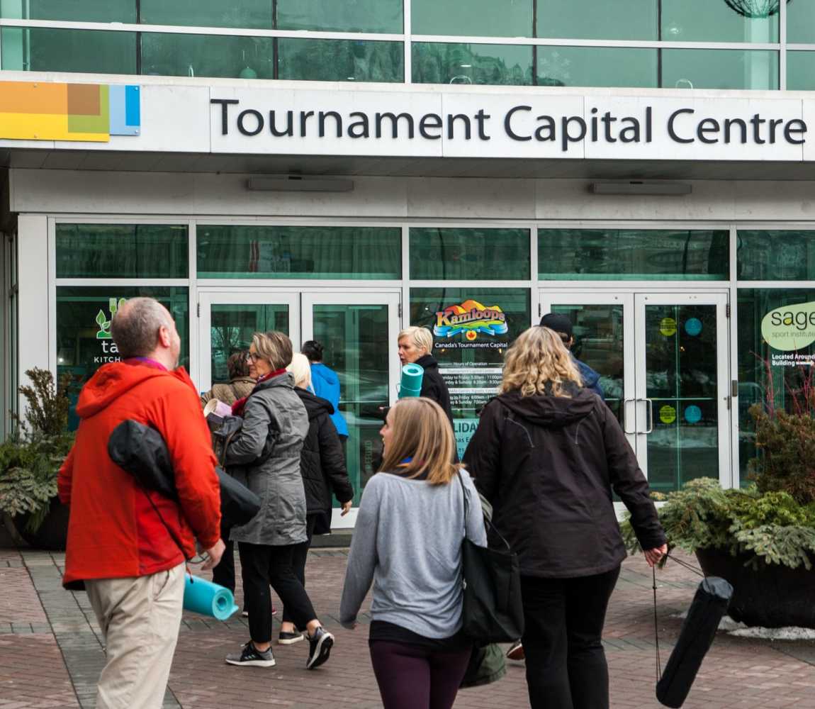 Group of people walking into the Tournament Capital Centre in Kamloops, BC.
