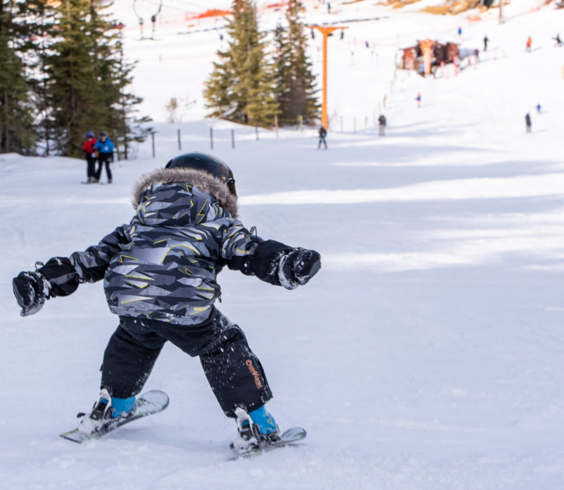 Boy skiing down Harper Mountain in Kamloops, BC.