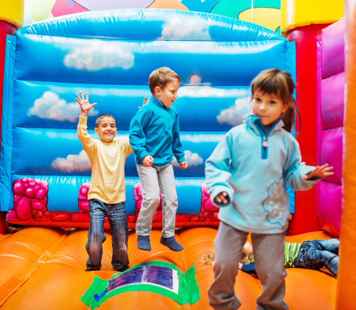 Children bouncing in an inflatable bouncy house