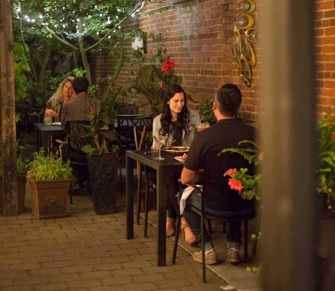 A couple dining on the outdoor patio at Brownstone Restaurant in Kamloops