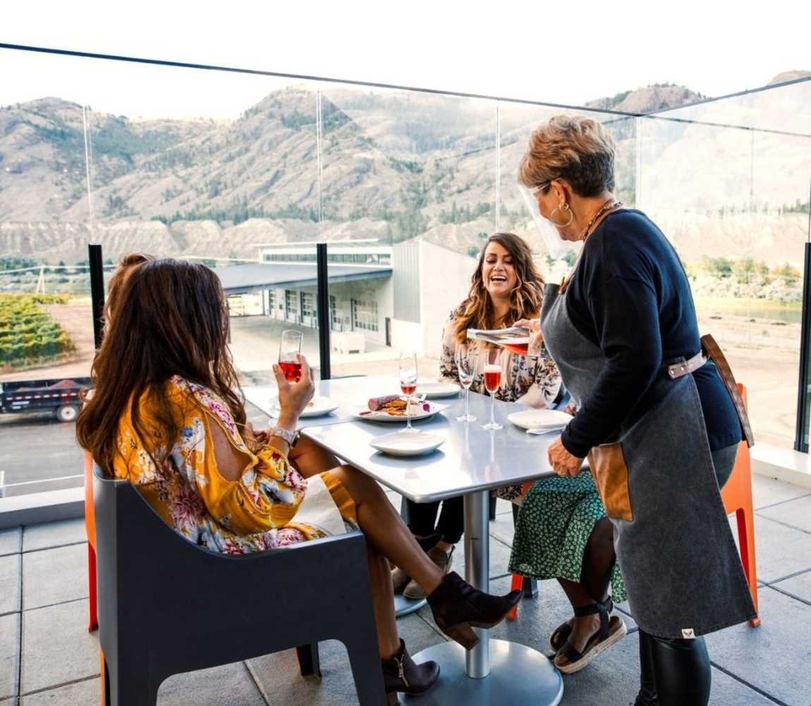 Group of women enjoying wine on the patio at Monte Creek Winery