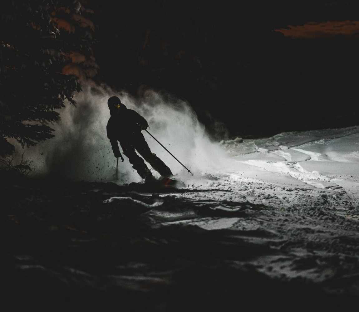 skiing at night on a groomed run at harper mountain in kamloops bc