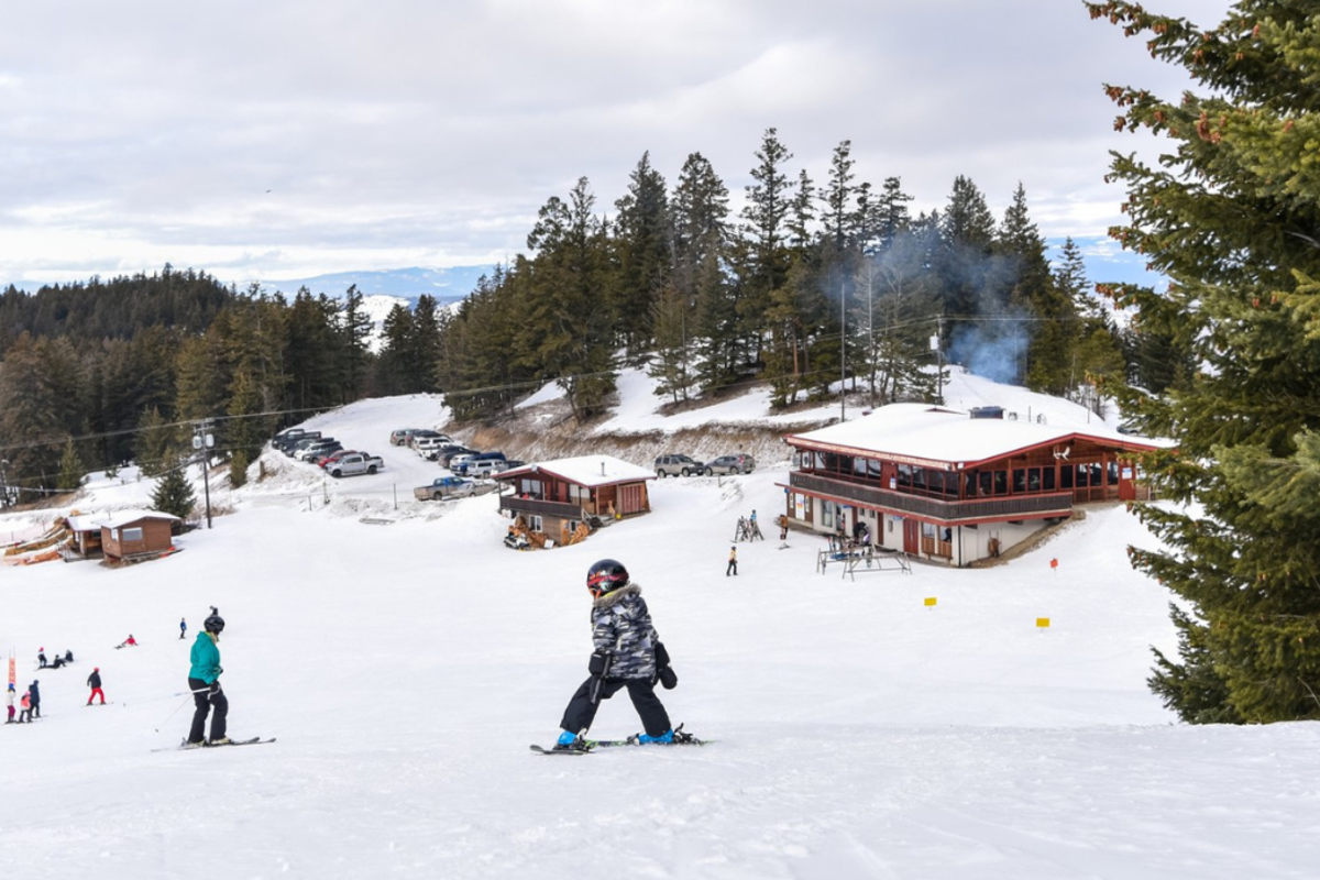 Family skiing at Harper Mountain in Kamloops, BC.