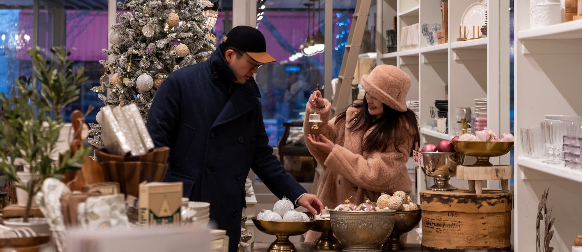 A couple Christmas shopping at Jardines Domaine shop located in downtown Kamloops, BC.