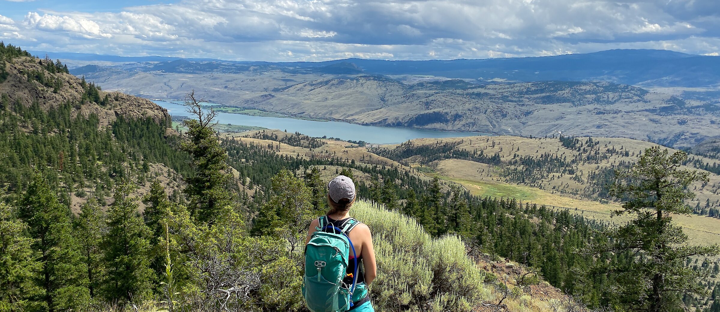 Woman admiring the view of Kamloops from her hike.