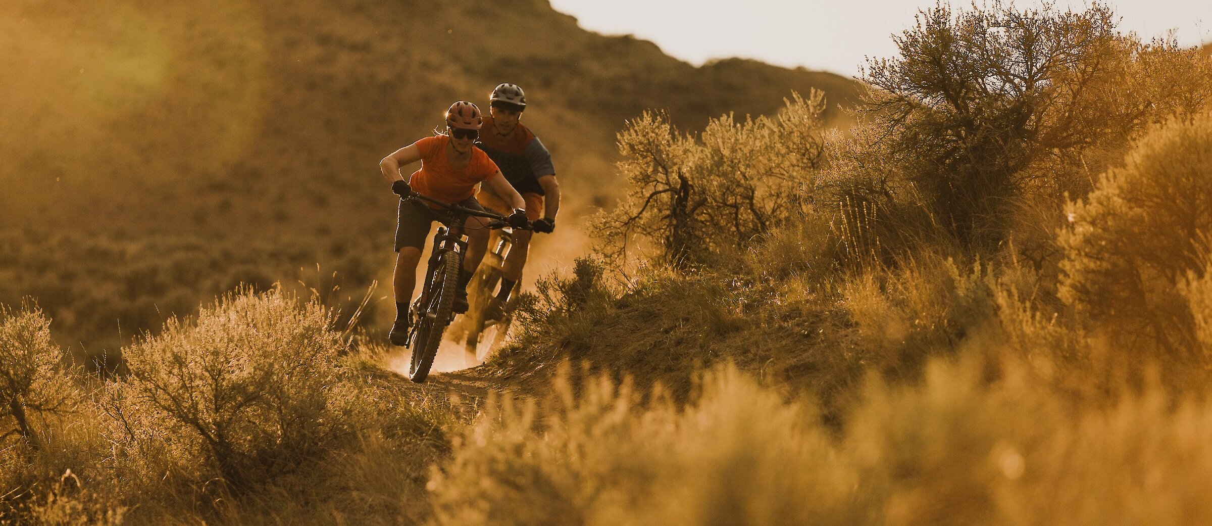 Couple mountain biking in Lac du Bois Grasslands in Kamloops, BC.