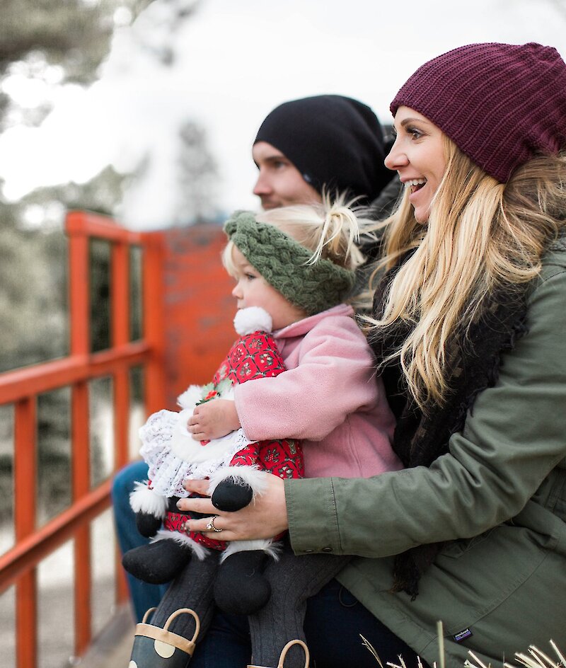 A family smiling on their tractor hayride at Privato Vineyard and Winery in Kamloops BC.