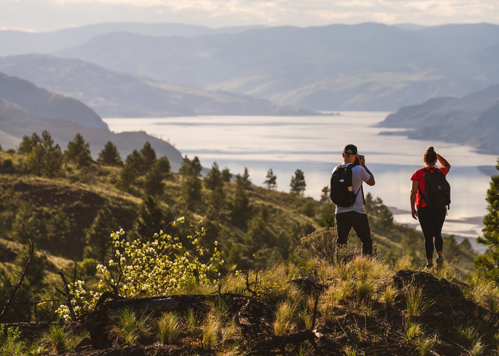 Group of Snowshoers admiring the view from Harper Mountain over the Thompson Valley in Kamloops, BC.