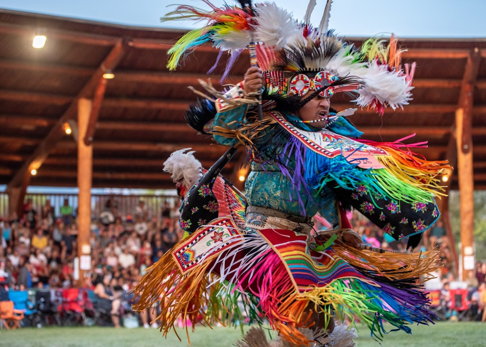 Dancer performing at the Kamloopa Powwow wearing traditional indigenous regalia, located at Tk'emlúps te Secwépemc Powwow Arbour.