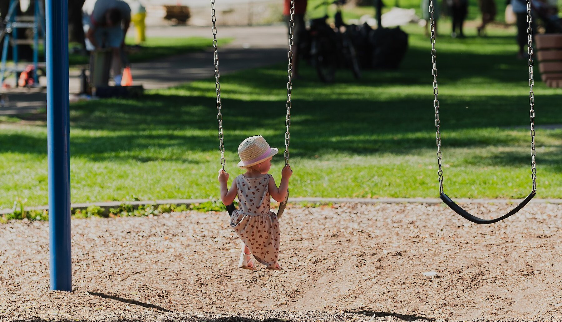 Girl playing on the playground at Riverside Park in downtown Kamloops, BC.