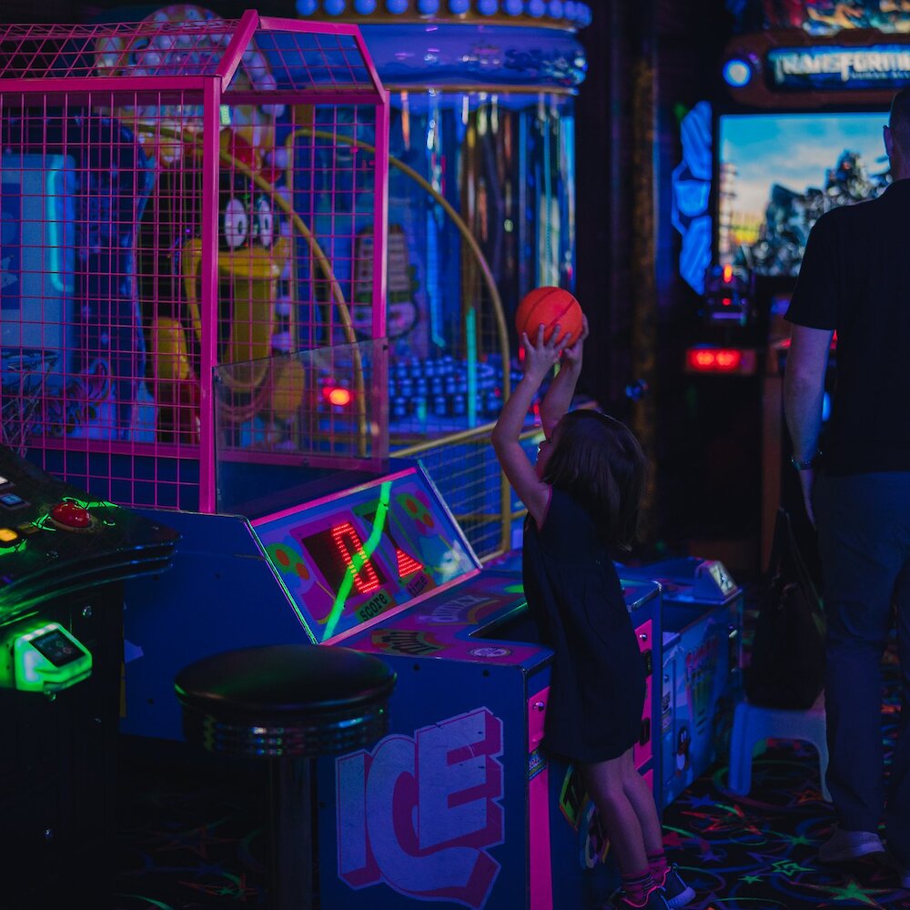 Girl shooting a basketball at the Fun Factor Fun Centre in Kamloops, BC.