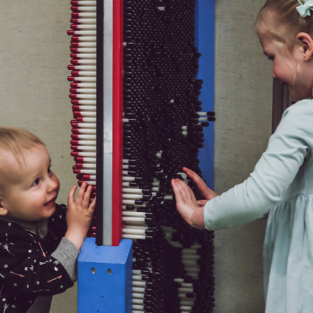 Two children playing with the interactive exhibit at the BIG Little Science Centre in downtown Kamloops, BC.