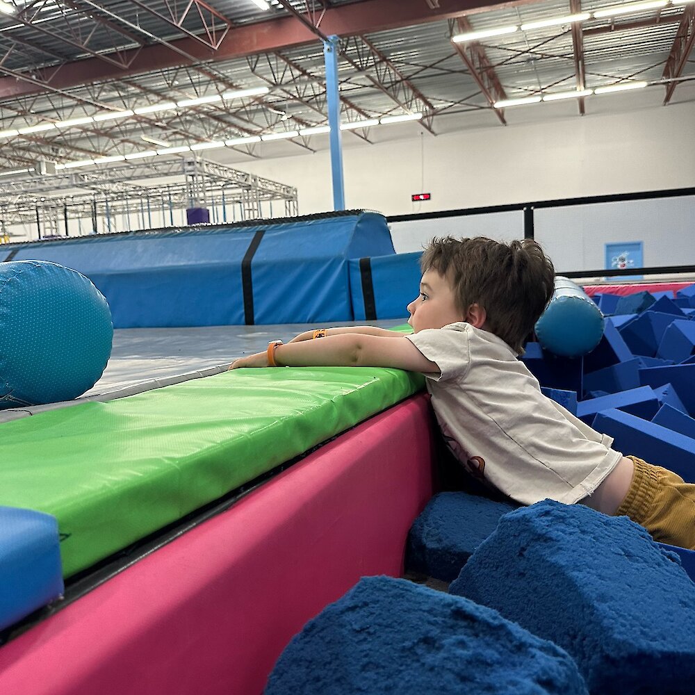 Boy playing at the trampoline park at Apex Adventure Plex in Kamloops, BC.