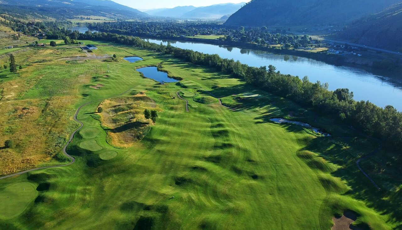 An aerial shot of the Dune at Kamloops Golf Course, with rolling greens alongside the North Thompson River.