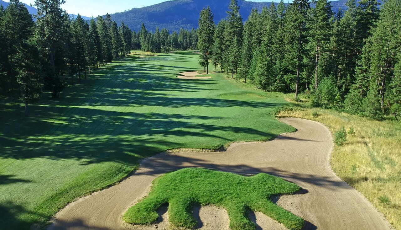 View of Talking Rock Golf Course near Kamloops BC, with a bear-shaped grass feature among a sand trap.