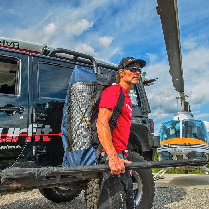 Bodie Shandro with his gear preparing to board the helicopter for the heli-SUP experience.