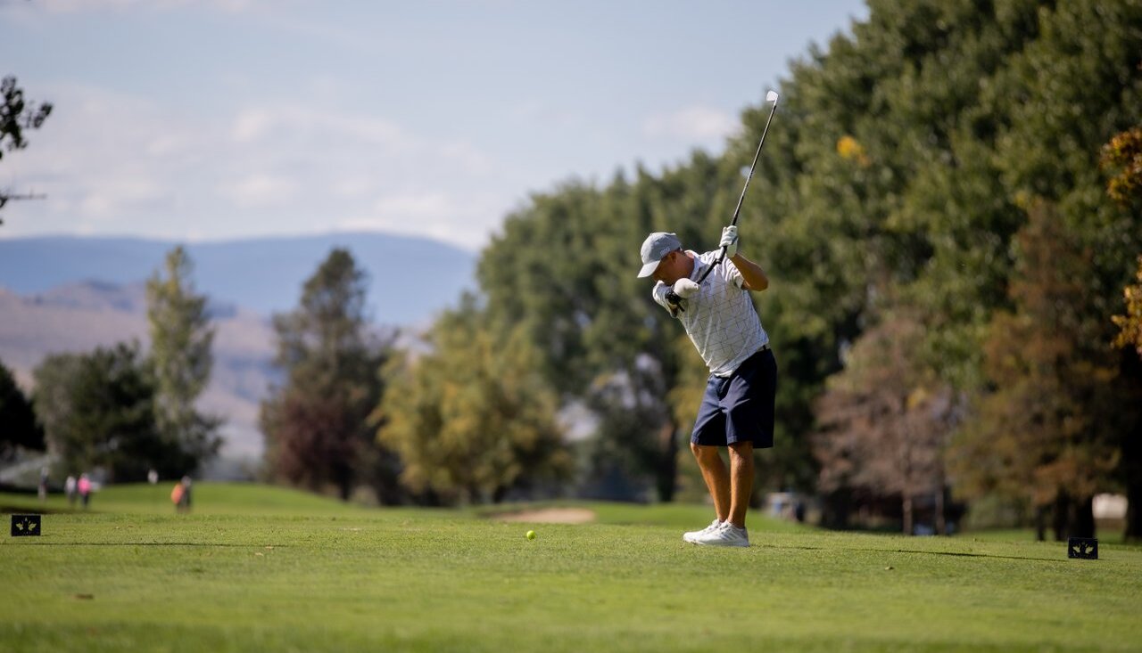 A golfer tees off at the Kamloops Golf & Country Club.