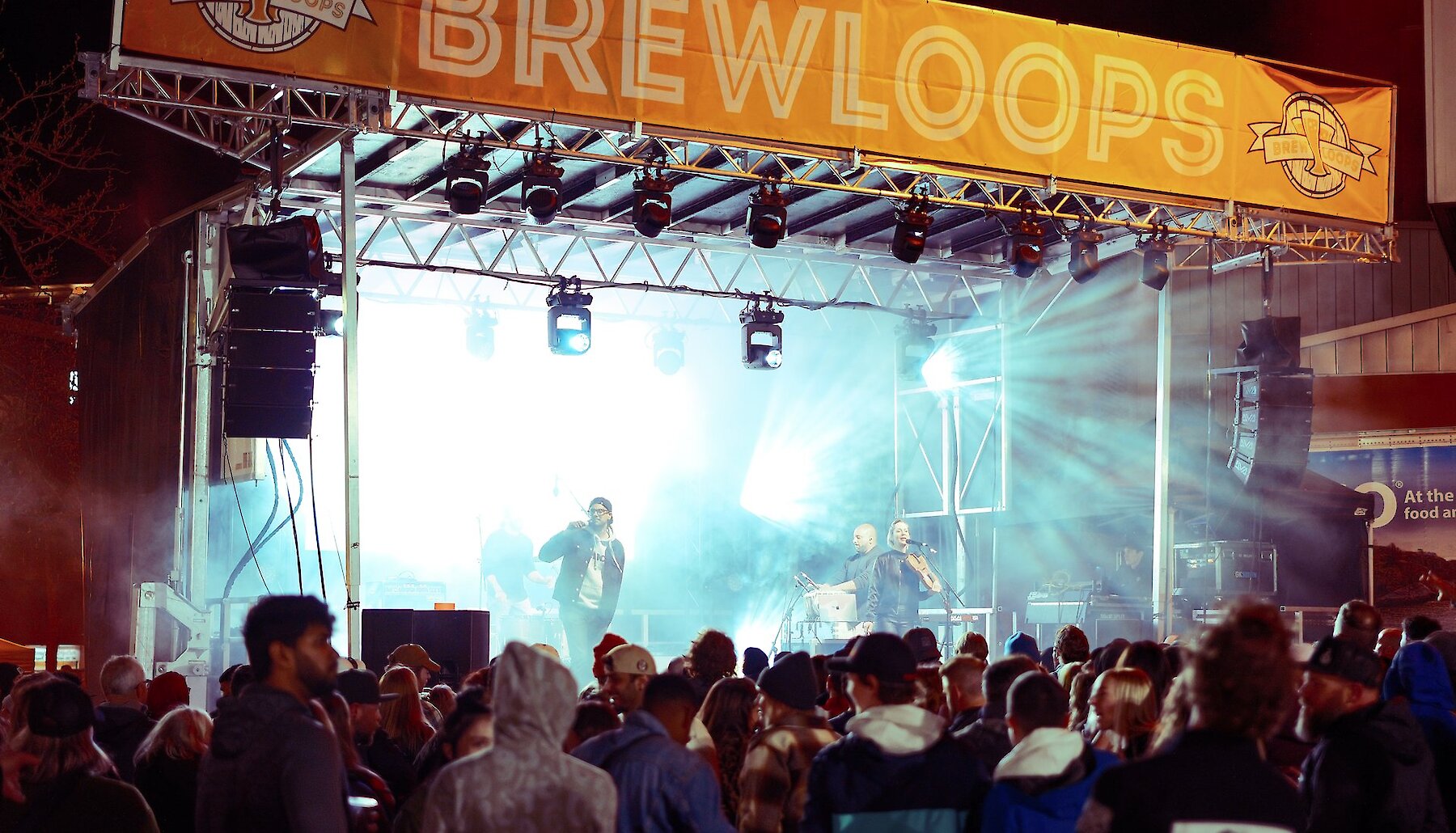 A stage at Brewloops is brightly lit at a night event in Kamloops.