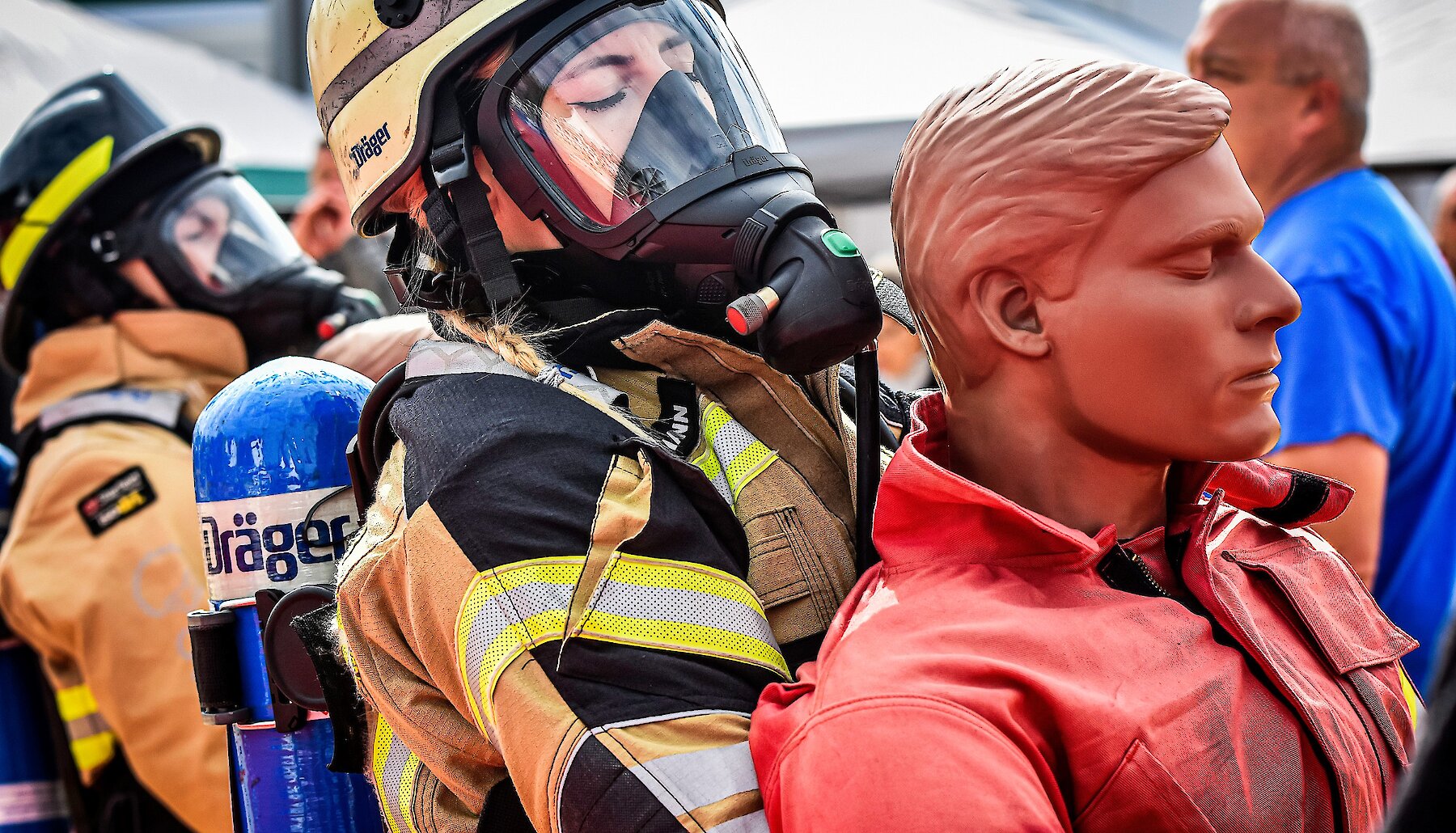 A firefighter in full gear drags a dummy at the Firefit Championship event.