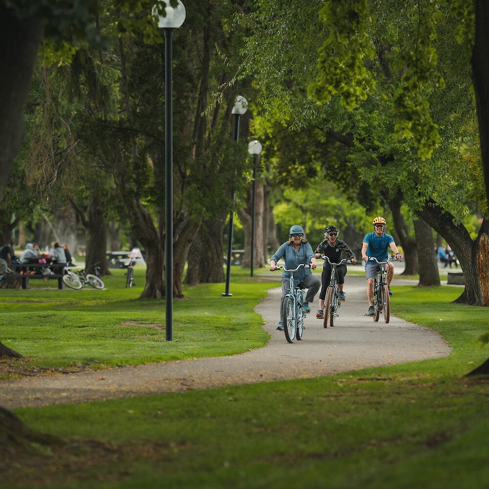 Group of ebike riders in Riverside Park located in downtown Kamloops, BC.