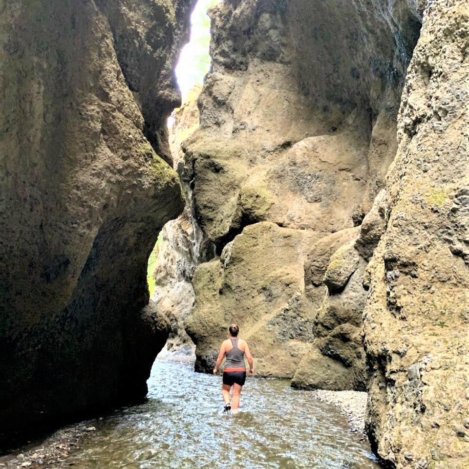 Hiking along the creek through a slot canyon trail in Kamloops BC.