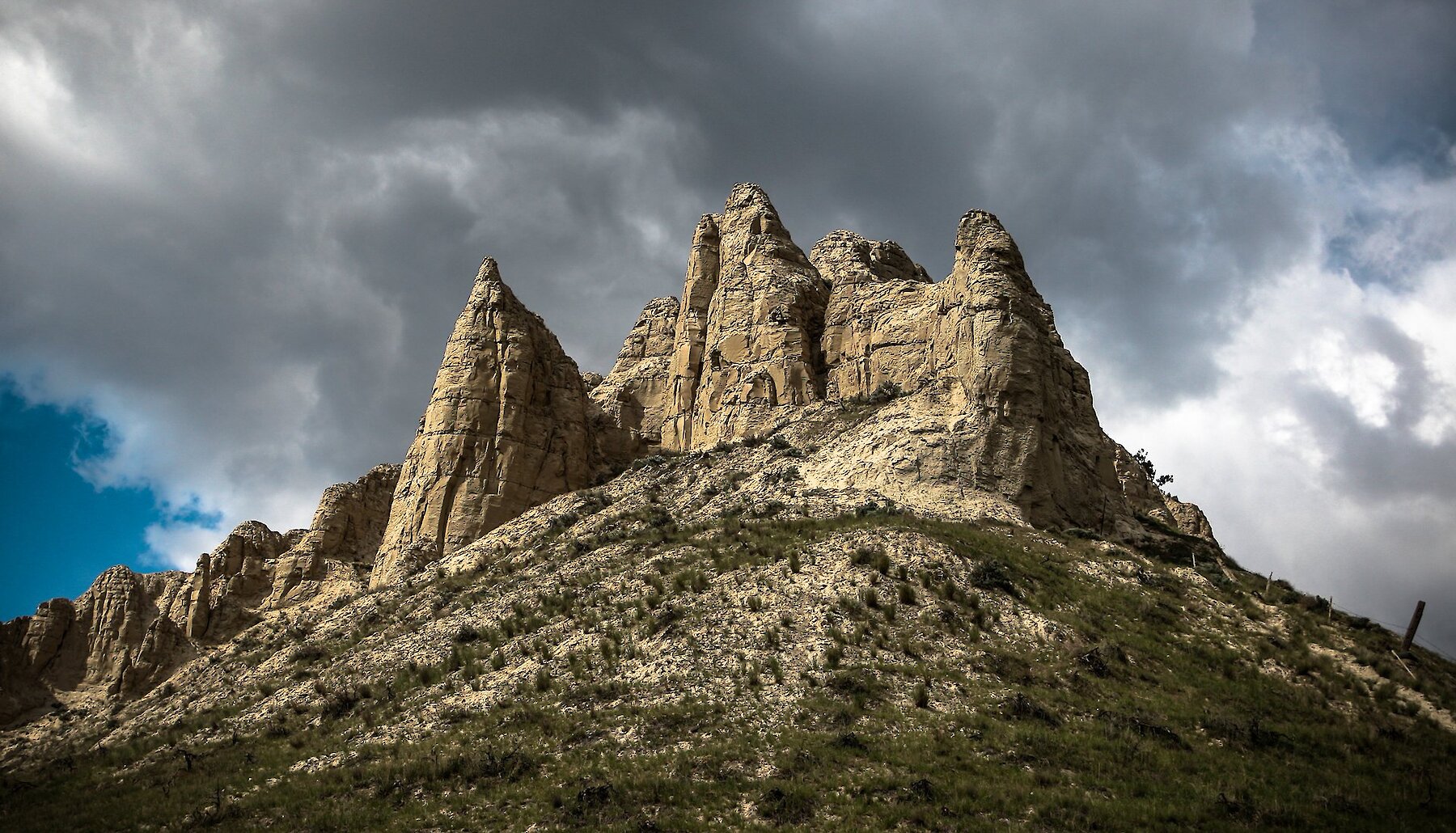 A view of dramatic hoodoos against a stormy sky in Kamloops BC.