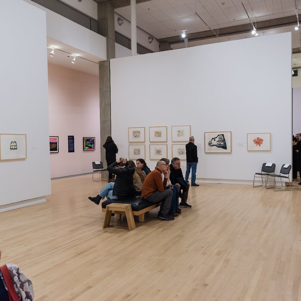 Individuals viewing the exhibits at the Kamloops Art Gallery.