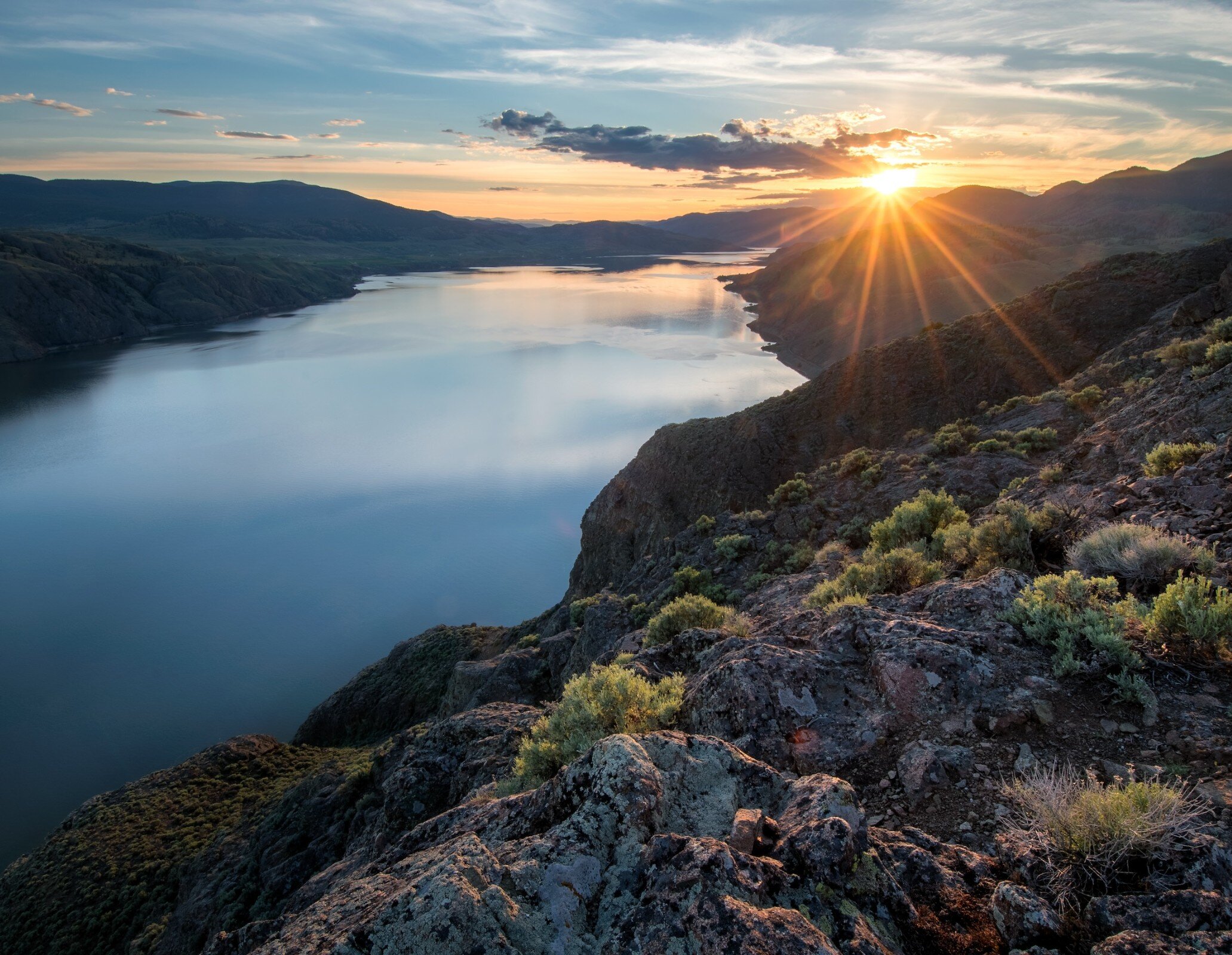 The sun setting over Kamloops Lake from the view of Battle Bluffs in Kamloops, BC.