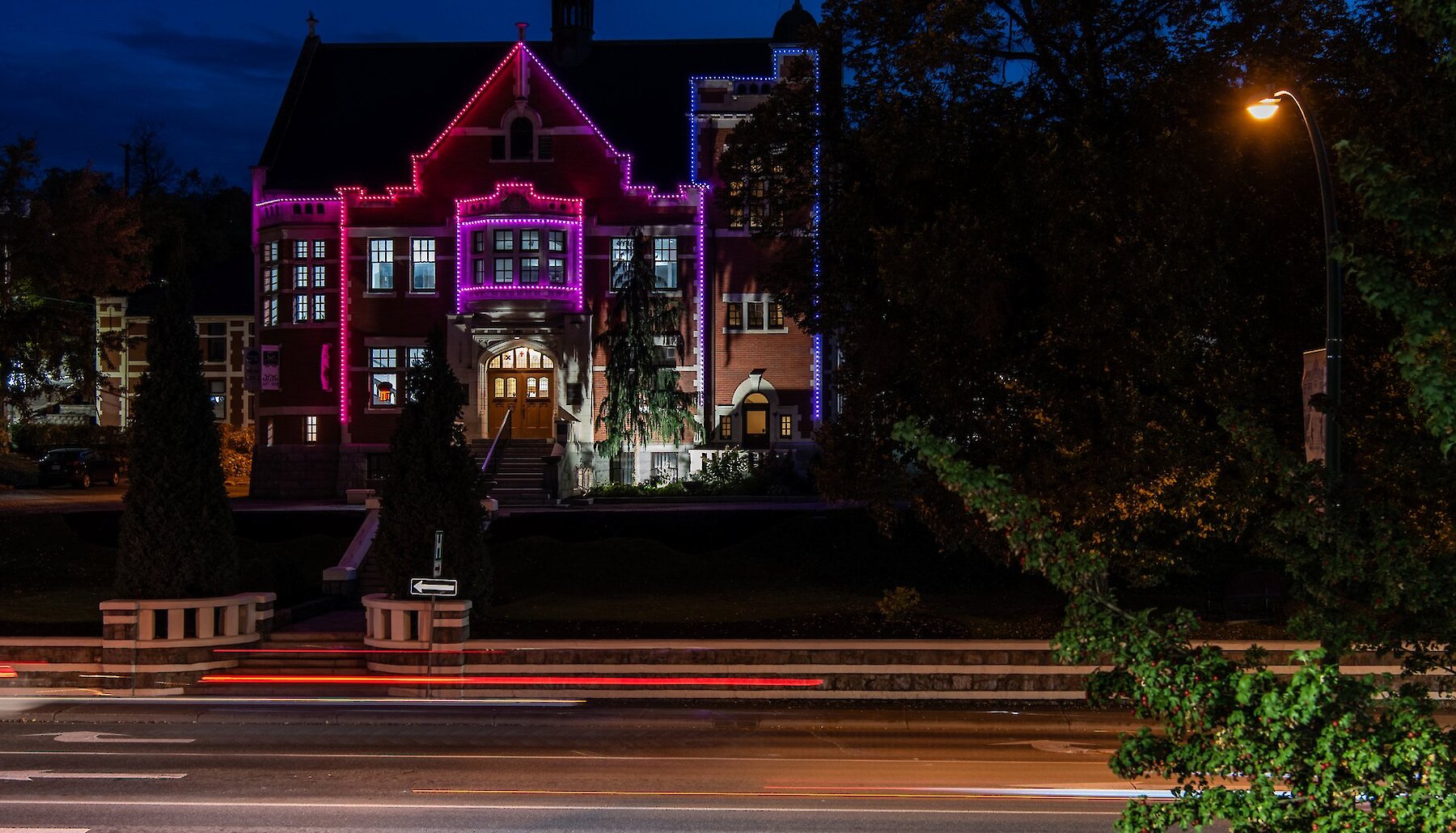 The Kamloops Courthouse decorated with bright festive lights at night in downtown Kamloops, British Columbia.