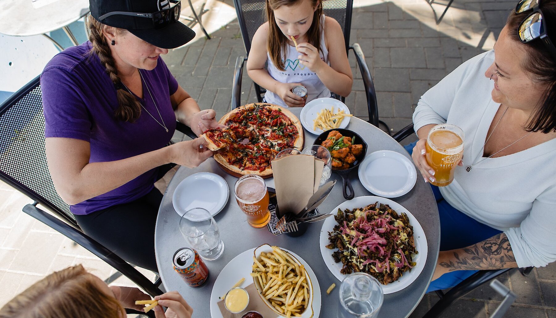 A family with kids dining on the patio at Bright Eye Brewing located on the North Shore in Kamloops, BC.